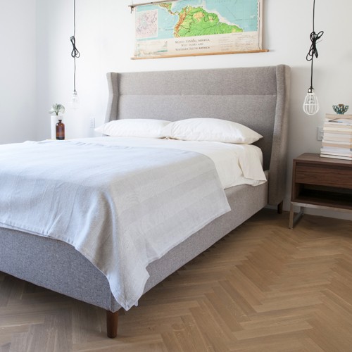 modern bed with pendant lights.