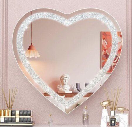 Casmer Crystal Heart LED Mirror LED light mirror providing ideal lighting for selfies and videos.